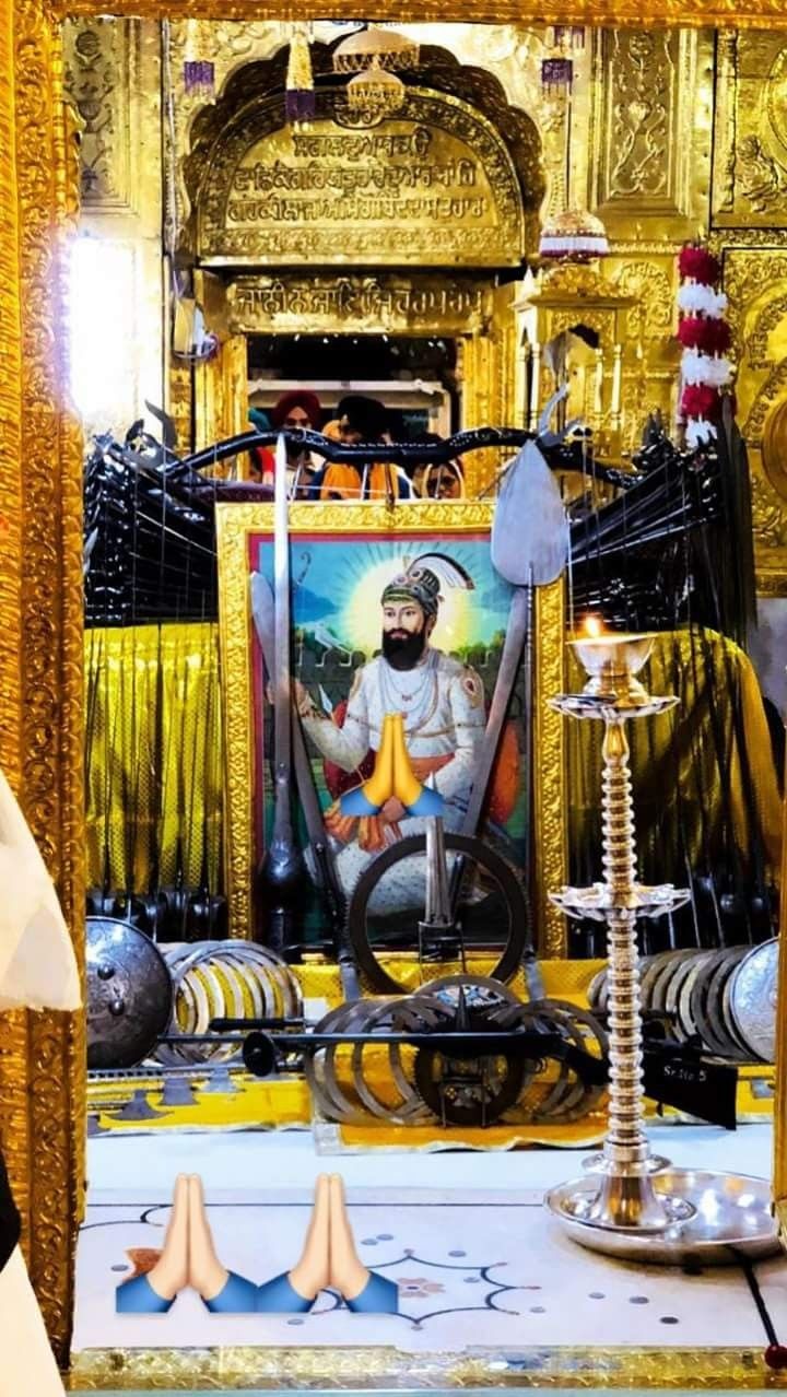 the interior of a shrine with gold and black decorations