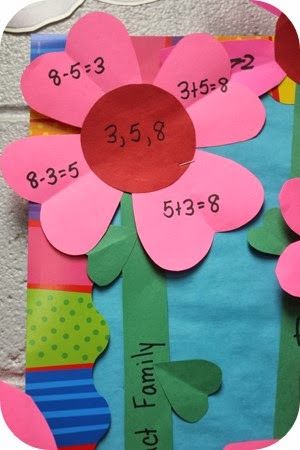 a flower made out of construction paper with numbers on the side and flowers in the middle