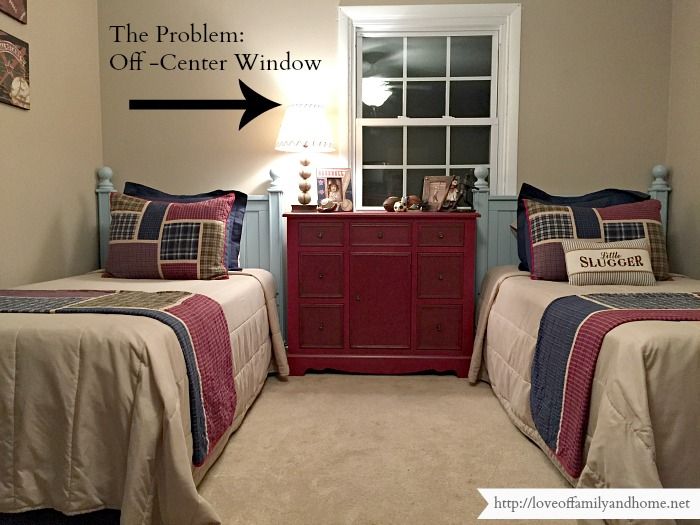 two twin beds in a bedroom with the same bedding and pillows on each side