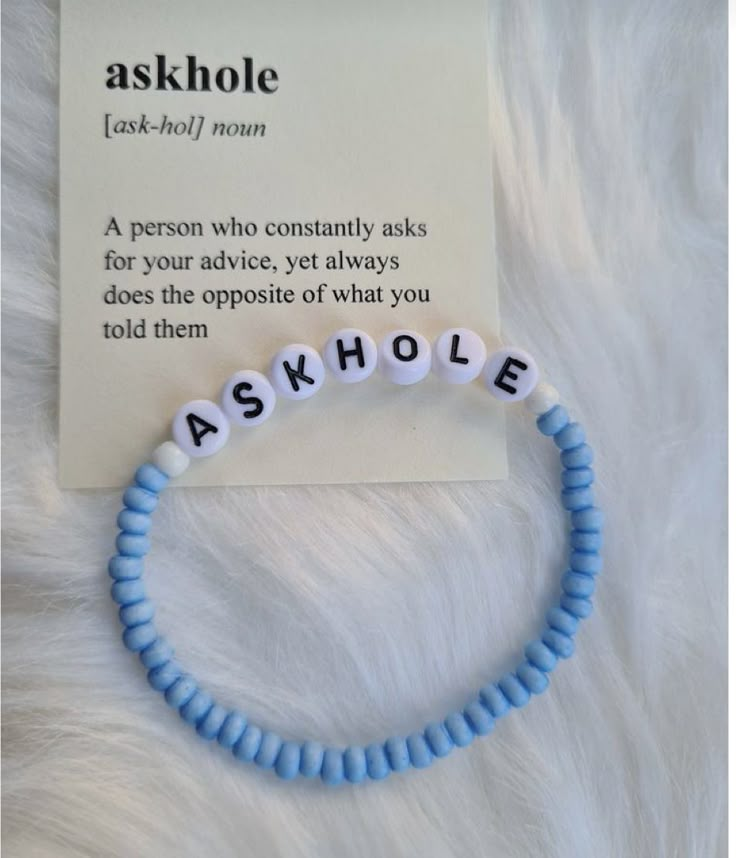 a bracelet with the word askhole written on it