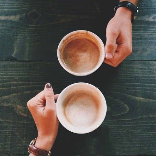 two people holding coffee cups with the words imagine and chance