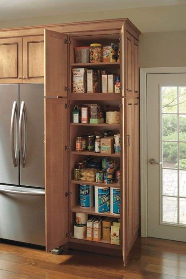 a kitchen pantry with lots of food in it