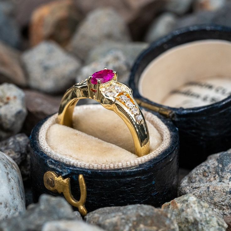 This charming ring is centered with one (1) marquise cut ruby set into a four-prong setting. The shoulders of the ring are each accented with six (6), prong set, round brilliant cut diamonds. The ring measures 6.6mm at the top, rises 4.7mm above the finger, tapering to 2.4mm wide and 1.1mm thick at the base of the shank. This ring is currently a size 6.75. Luxury Marquise Ruby Ring With Diamonds, Luxury Ruby Marquise Cut Rings, Luxury Ruby Ring Marquise Cut For Formal Events, Luxury Ruby Marquise Cut Ring For Formal Occasions, Elegant Marquise Ruby Ring With Vvs Clarity, Classic Marquise Ruby Ring With Brilliant Cut, Luxury Marquise Cut Ruby Ring For Formal Occasions, Classic Marquise Ruby Ring With Vvs Clarity, Marquise Ruby Ring With Center Stone For Promise