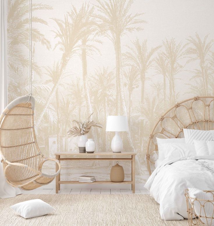 a bedroom with pink palm trees on the wall and white bedding, two wicker chairs