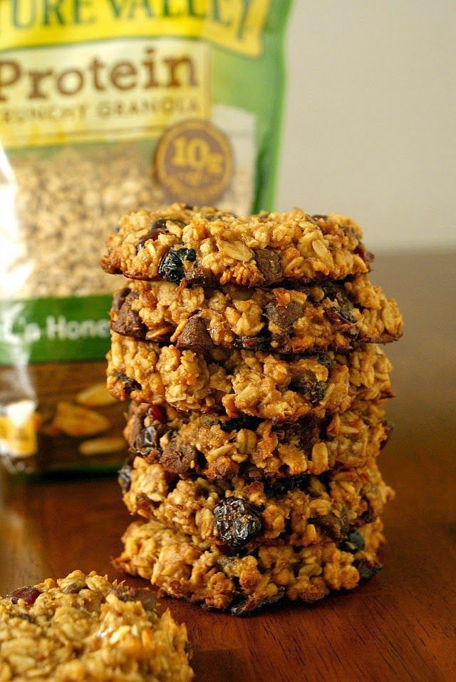 granola cookies stacked on top of each other next to a bag of pure valley protein