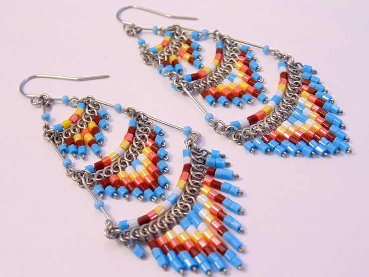 These gorgeous earrings were hand beaded in Peru. They measure 3 inches in length, 1 inch in width, with surgical steel ear wires. Dangle Beaded Earrings For Festivals With Ear Wire, Dangle Beaded Earrings With Ear Wire For Festivals, Festival Dangle Beaded Earrings With Ear Wire, Dangle Beaded Earrings For Festivals, Handmade Multicolor Metal Chandelier Earrings, Handmade Metal Multicolor Chandelier Earrings, Traditional Nickel-free Beaded Dangle Earrings, Festival Beaded Metal Earrings With Ear Wire, Festival Metal Beaded Earrings With Ear Wire