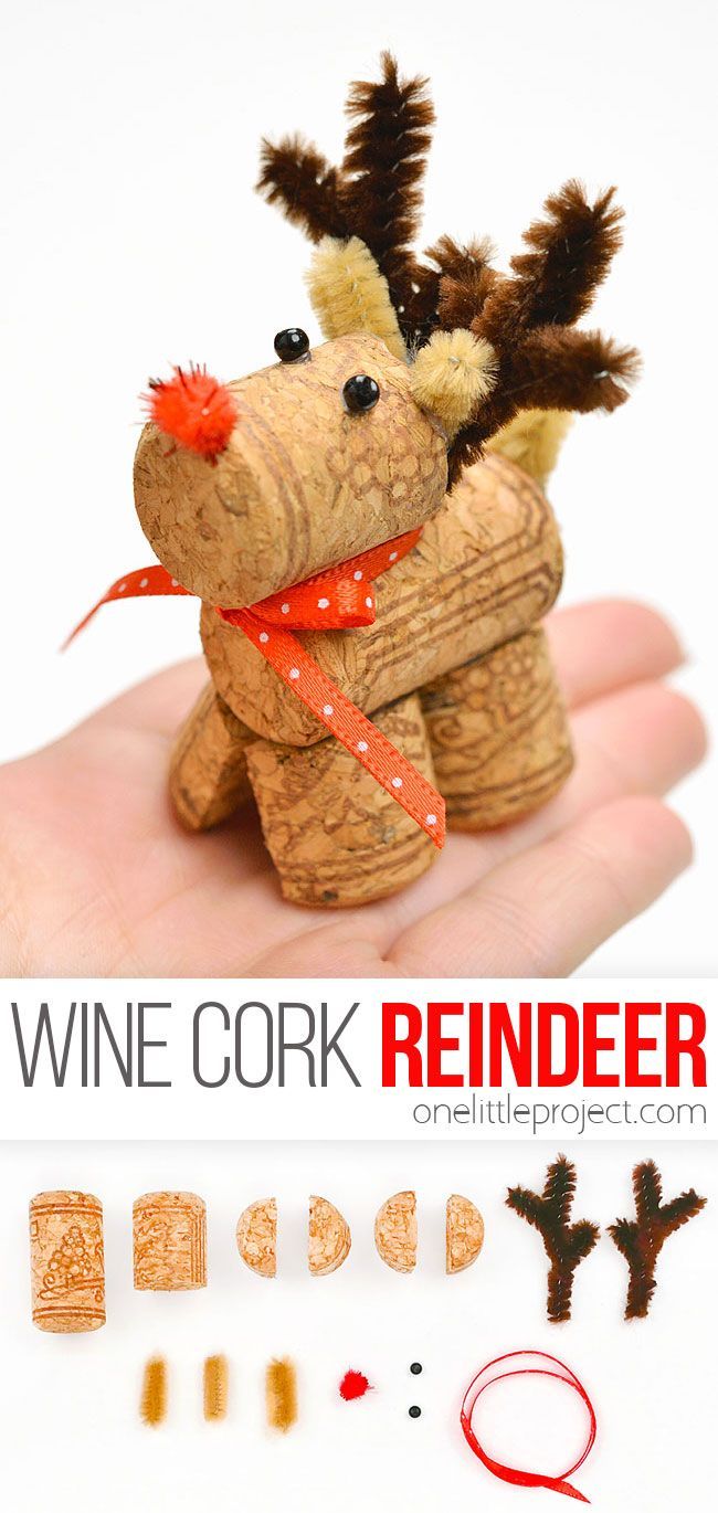 a hand holding a wine cork reindeer ornament with the words, wine cork reindeer on it