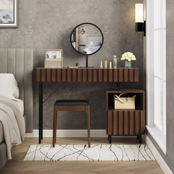 a bedroom with a bed, mirror and two stools in front of the table