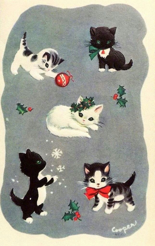 a card with kittens and christmas decorations on the front, one cat is laying down