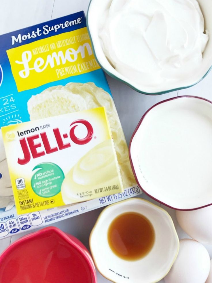 ingredients to make lemon jello sitting on a counter top, including yogurt and eggs