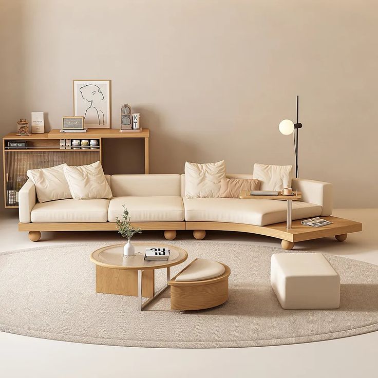 a living room filled with furniture and a white rug on top of a wooden floor