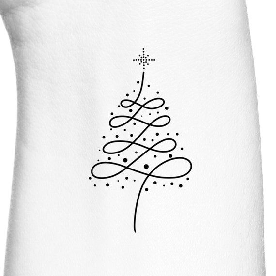 a christmas tree tattoo on the back of a white shirt