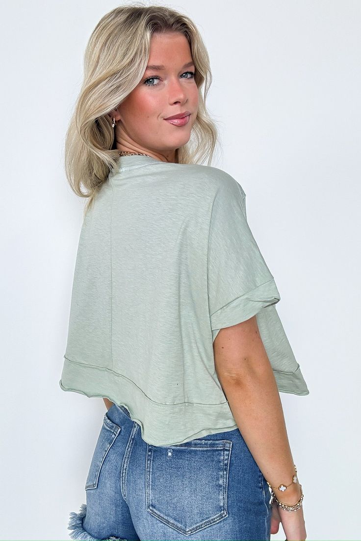 Details: This Erika Raw Edge Pocket Top is the perfect combination of edgy and practical. With raw edge detailing and a convenient pocket, you can show off your unique style while keeping your essentials close by. Stay cool and confident in this playful and versatile top. - Short sleeves - Relaxed fit Content: 100% cotton Size + Fit: Model is 5'8" and wearing a Small - Approximate measurements from a size Small - Full length: 19" - Chest: 60" - Waist: 60" - Sleeves: 12" Brand: Charlotte Avery Chic Crew Neck Tops With Pockets, Trendy Washed Tops For Layering, Edgy Soft-washed Tops For Spring, Everyday Spring Tops With Pockets, Tops With Pockets For Everyday Spring Wear, Spring Tops With Pockets For Everyday, Trendy Solid Color Tops With Pockets, Casual Top With Frayed Hem For Day Out, Casual Tops With Frayed Hem For Day Out