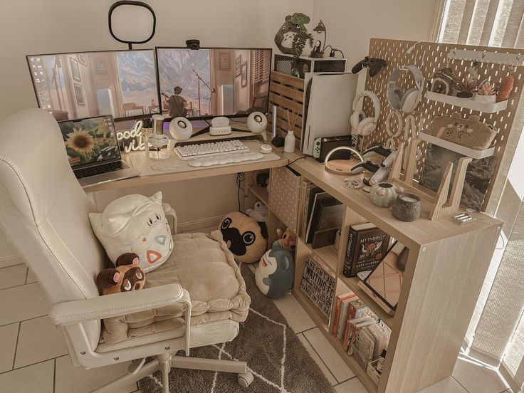 a computer desk with two monitors on it and stuffed animals in front of the monitor