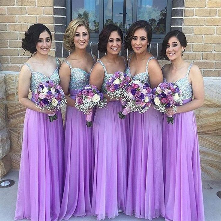 the bridesmaids are all wearing purple dresses