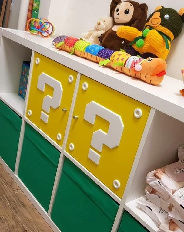 there are many stuffed animals on top of the shelves in this children's room