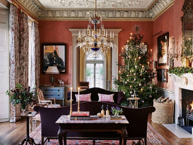 a living room filled with furniture and a christmas tree in the middle of the room