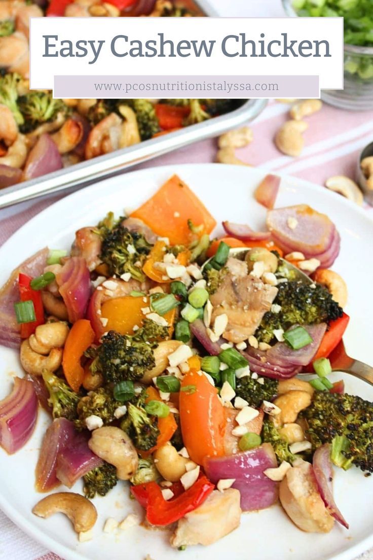 a white plate topped with broccoli, carrots and cashew chicken stir fry