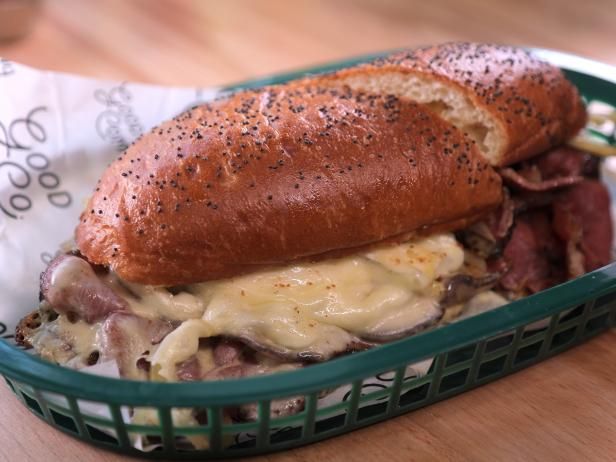 a close up of a sandwich in a basket on a table