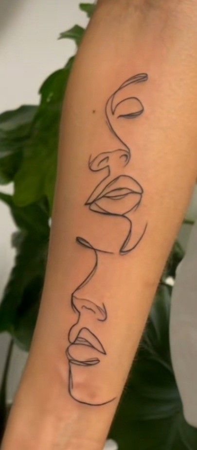 a woman's arm with the word love written in cursive writing on it