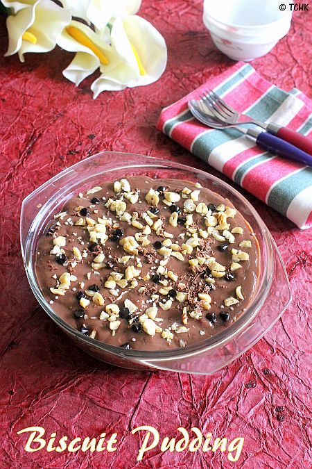 a dessert dish with nuts and chocolate in it on a table next to napkins