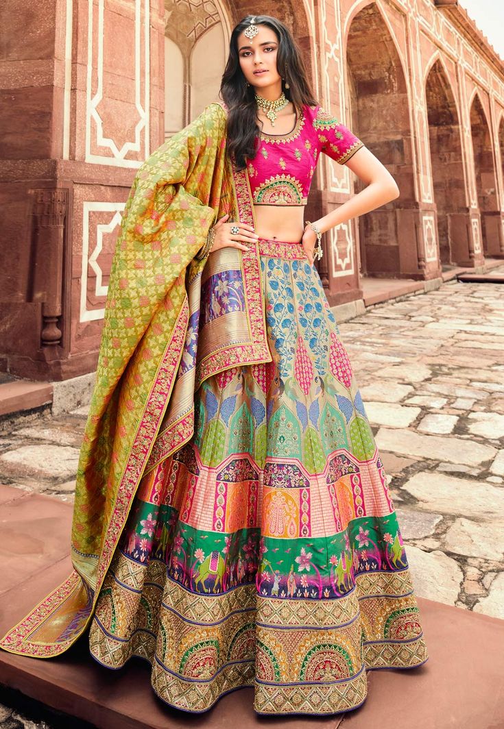 Banarasi silk a line lehenga choli in Beige colour 10198  Desc:  Style : A Line Lehenga Choli Color : Beige   Magenta Fabric : Banarasi Silk Work : Embroidery Wash Care : Dry clean Sleeve Style : Half Sleeve Long Sleeves : Done only in Custom Stitch Sleeves Lining : Done only in Custom Stitch Bust Size : 32 to 42 Inches Occasion : Wedding   Sangeet   Engagement   Reception   Ceremonial   Navratri   Baby Shower. With Express Free Shipping and Custom Stitching, Buy Indian Party wedding wear bridal Multicolor Lehenga, Anarkali Lehenga Gowns, Engagement Lehenga, Anarkali Lehenga, Reception Lehenga, Designer Bridal Lehenga, Neck Deep, Lehenga Choli Online, Ghagra Choli