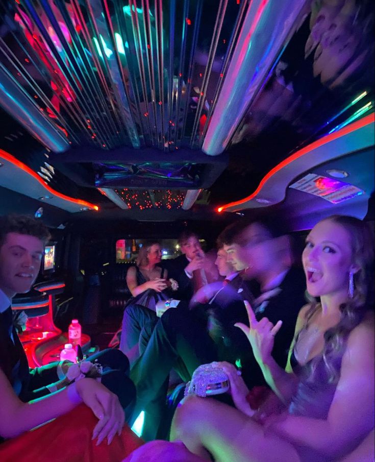 a group of people sitting in the back of a limo on a nightlife party