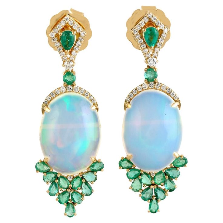 Cast in 14 karat gold. These earrings are handset in 12.48 carats Ethiopian opal, emerald and .34 carats of sparkling diamonds. FOLLOW MEGHNA JEWELS storefront to view the latest collection & exclusive pieces. Meghna Jewels is proudly rated as a Top Seller on 1stDibs with 5 star customer reviews. All items manufactured by us are handmade and can be customized or redesigned. Composition Size: 40X13MM Gold Weight(Gms)-6.347 Diamond Wt(Cts)-.34 Opal, Emerald Wt(Cts)-12.48 Cute Looks, S Jewelry, Jewelry To Make, Fine Jewels, Opal Earrings, Gorgeous Jewelry, Emerald Diamond, Opal Jewelry, Pretty Jewellery