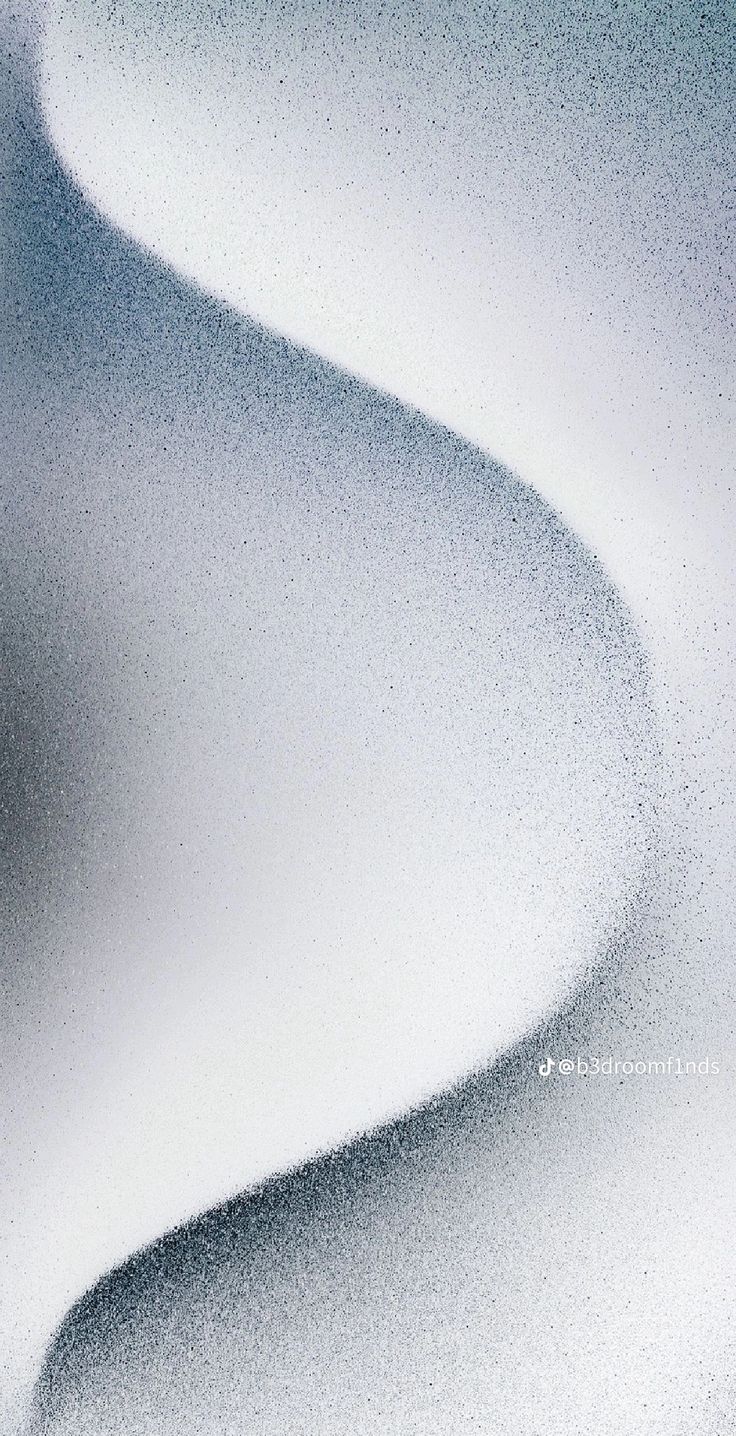 an abstract photo of white sand and water