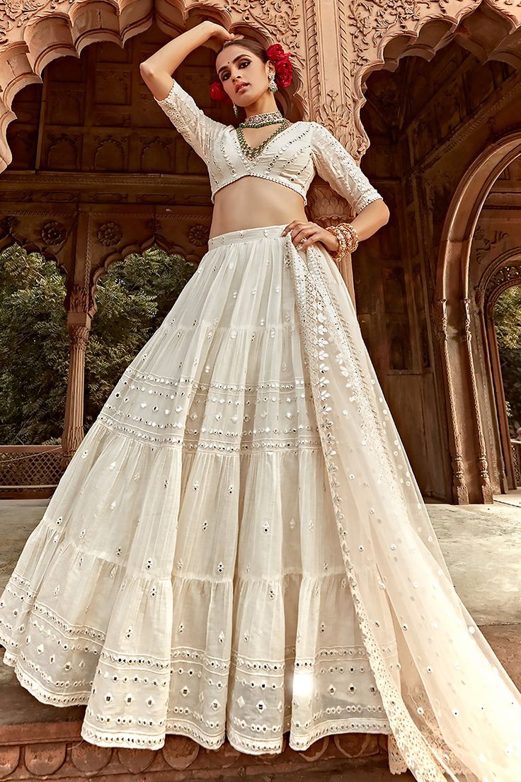 Off-white lehenga featuring intricate threadwork and mirror embellished stripe patterns on alternating tiers. Comes with a matching mirrorwork padded blouse and embroidered sheer dupatta.
Components: 3
Pattern: Embroidered
Type Of Work: Mirrorwork
Neckline: Plunge
Sleeve Type: Half
Fabric: Lehenga and Blouse: Cotton Mulmul, Dupatta: Butterfly Net, Tulle, Lining: Shantoon
Color: Off White
Other Details: 
Lace borders
Attached lining
Lehenga side zip closure
Length (in inches):42
Weight(in kgs): 2 White Chicken Lehenga, Mirrorwork Lehenga, Off White Lehenga, Drape Lehenga, Farewell Saree, Sheer Dupatta, Garba Dress, Lehenga And Blouse, Off White Designer