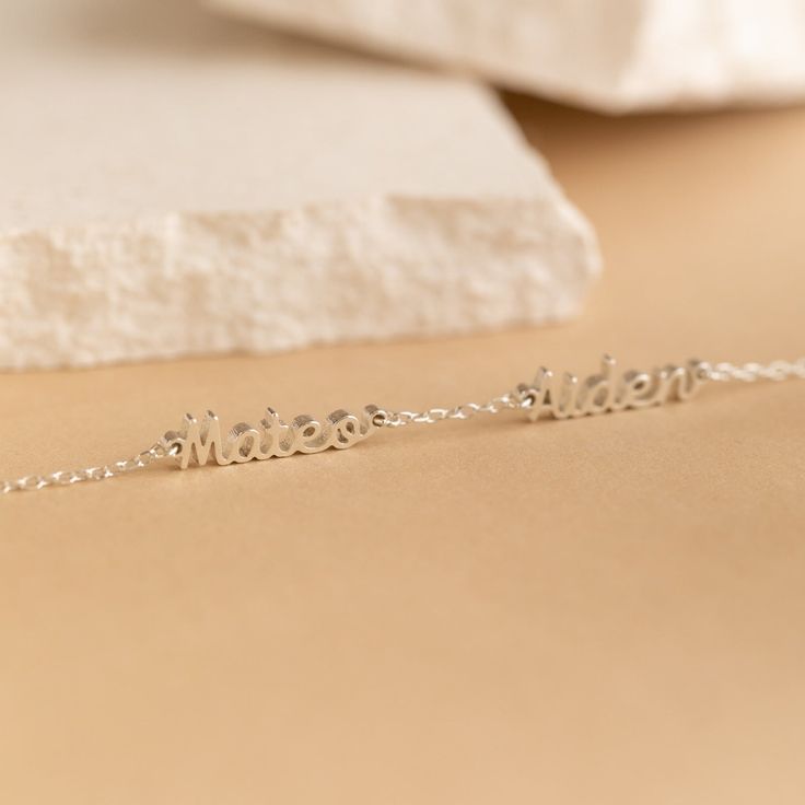 💝Gift-Worthy: Perfect for any occasion 💝 Add a touch of sentimentality to your jewelry collection with one of our Mini Multiple Name Bracelets! You can customize it with your name or a name of a loved one, turning it into a heartfelt and unforgettable gift ♡ The delicate chain, mixed with its lovely cursive font makes this adornment an everyday essential for every minimal jewelry lover! Material: High Quality Solid 925 Sterling Silver Finish: Sterling Silver ∙ 18K Gold ∙ Rose Gold Dimensions: Customizable Sterling Silver Name Bracelet Gift, Dainty Customizable Silver Bracelet, Meaningful Hypoallergenic Name Bracelet As Gift, Dainty Sterling Silver Name Bracelet For Mother's Day, Personalized Sterling Silver Chain Bracelet For Mother's Day, Customized Sterling Silver Name Bracelet Gift, Customized Sterling Silver Bracelets For Mother's Day, Custom Name Sterling Silver Bracelet For Gift, Personalized White Gold Name Bracelet As Gift