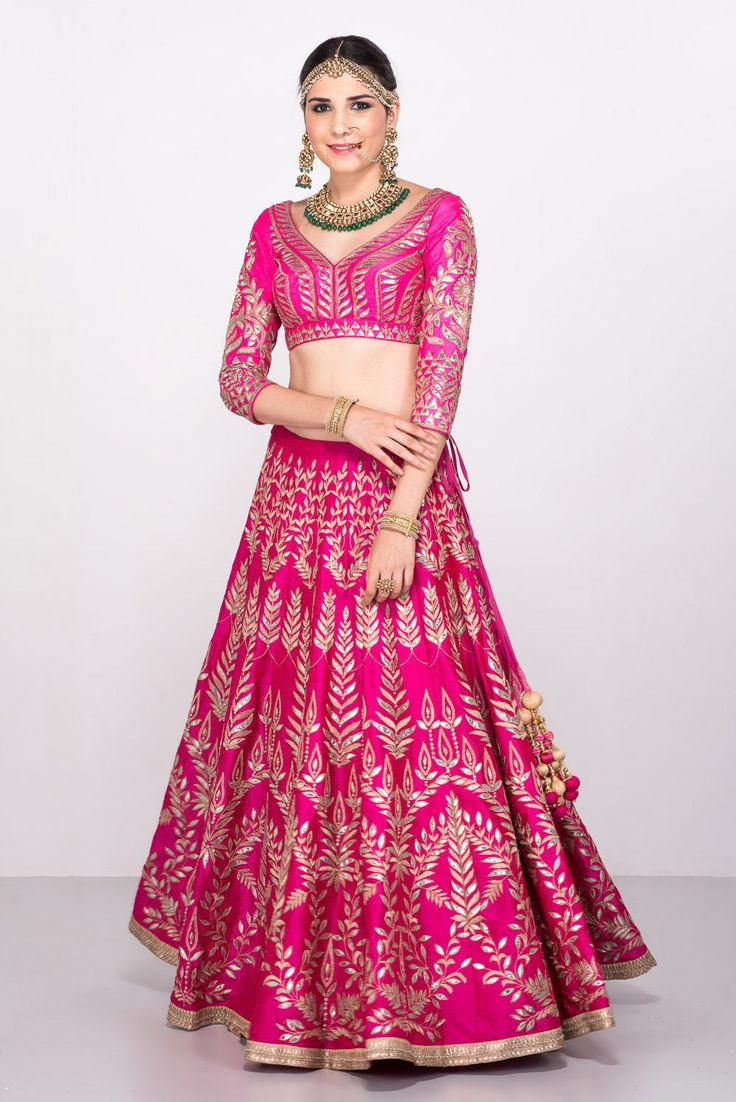 This gotta patti lehenga set features a pink blouse fabricated in pure raw silk with a matching pink lehenga. The entire lehenga set is filled with flawless zari and gotta patti work in floral patterns. It also has a net dual pink dupatta that matches the entire set. Both the dupatta corners and the lehenga bottom have a silver border that perfectly complements the pink coloured lehenga set. Pink Choli Design, Gotta Patti Lehenga, Bridallehenga Bridal, Gotta Patti Work, Lehenga Anarkali, Pink Dupatta, Gotta Patti, Designer Bridal Lehenga, Indian Bridal Lehenga