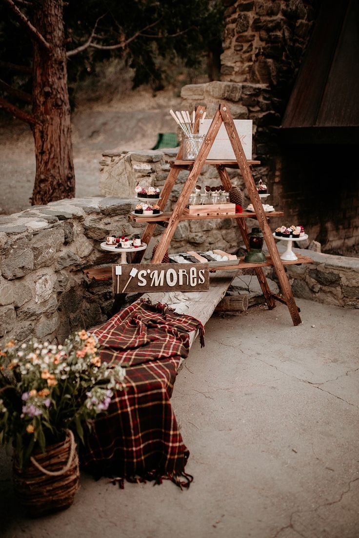 an outdoor picnic area with food and flowers