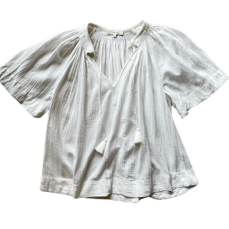 Vince Condition: Nwot - Brand Tag Fell Off In Storage Bin - Never Worn, Material Tag Still In Tact. Color: White Description Perfect For Everything From Running Errands To Your Next Resort Vacation To Exploring A Festival To Just Lounging Around The House, This Boho Top From Vince Is Reminiscent Of The Great. Details - Split V-Neckline With Self-Tie Tassel Detailing - Shirring Around The Shoulders And Back - Short Sleeves - Pullover Construction - Relaxed, Flowy Silhouette - 100% Cotton Measurem Chic White Tops With Tassels, Chic White Tassel Tops, White Cotton Top With Back Tassel Tie-up, Casual V-neck Tops With Tassel Ties, White Cotton Top With Tassels, White V-neck Top With Tassels, White Casual Top With Tassel Ties, White Casual Tops With Tassel Ties, Casual White Tops With Tassel Ties