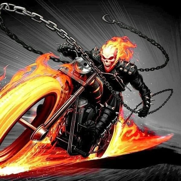 a man riding on the back of a motorcycle with flames coming out of his tires