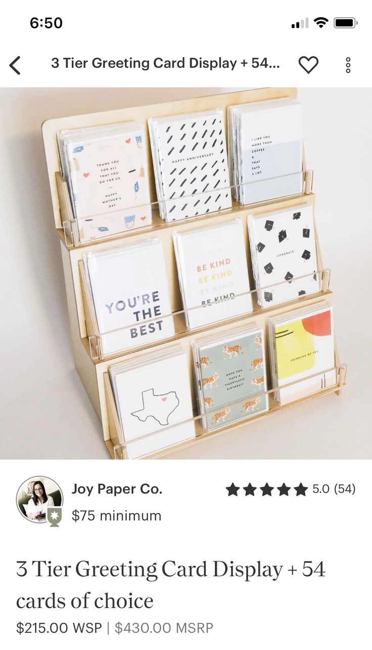 a wooden shelf with several cards on it