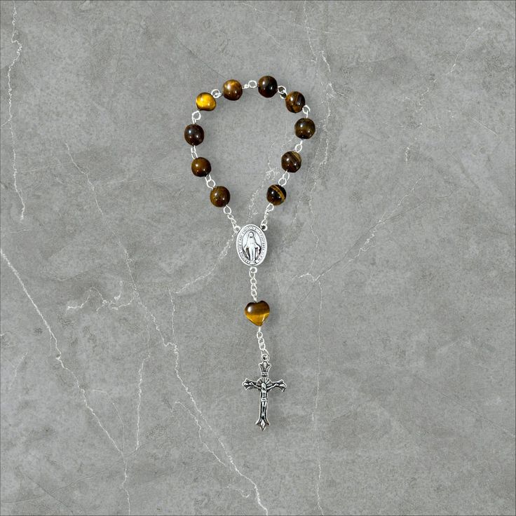 Embrace the serenity of prayer wherever you go with our exquisite Single Decade Pocket Rosary. Meticulously handcrafted with care and devotion. 🌟 Features: - Authentic craftsmanship: Handmade with love and precision. - Compact design: Fits snugly into your pocket, purse, or backpack for easy carrying. - Quality materials: Crafted using high-quality beads. - Elegant aesthetics: Delicately designed to inspire peace and tranquility during prayer. 🙏 Purpose: Designed for those seeking solace in th Round Polished Bead Rosary As Gift, Polished Round Beads Rosary As Gift, Adjustable Spiritual Rosary With Spacer Beads, Adjustable Rosary With Polished Beads For Meditation, Adjustable Polished Beads Rosary For Meditation, Spiritual Rosary Bracelet With Polished Beads, Adjustable 8mm Beads Rosary For Healing, Gemstone Beads Rosary As Gift, Spiritual Rosary With Spacer Beads