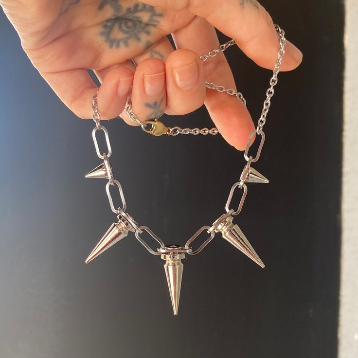 I made this spikey necklace for myself from leftover pieces to the wall hanging collection, and decided to make a few more with whats left. Materials: Stainless steel Length options: 16" or 18" *I'm wearing a 16" length in the second photo. The Mini Spikey Necklaces have only small spikes and come with a 15" chain and toggle clasp. They are limited and ready to ship. 16 Inch Sterling Silver Everyday Jewelry, Tarnish Resistant Silver Stainless Steel Jewelry, Metal Chain Necklace For Everyday Use, Trendy Necklaces With Lobster Clasp For Everyday Use, Trendy Necklaces For Everyday Use, Adjustable Stainless Steel Charm Necklaces, Trendy Silver Stainless Steel Charm Necklaces, Everyday Silver Choker Charm Necklace, Trendy Adjustable Chain Jewelry For Everyday