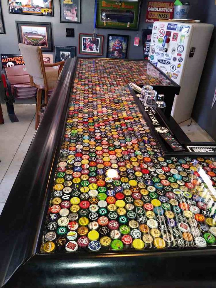 a long table covered in lots of different colored buttons