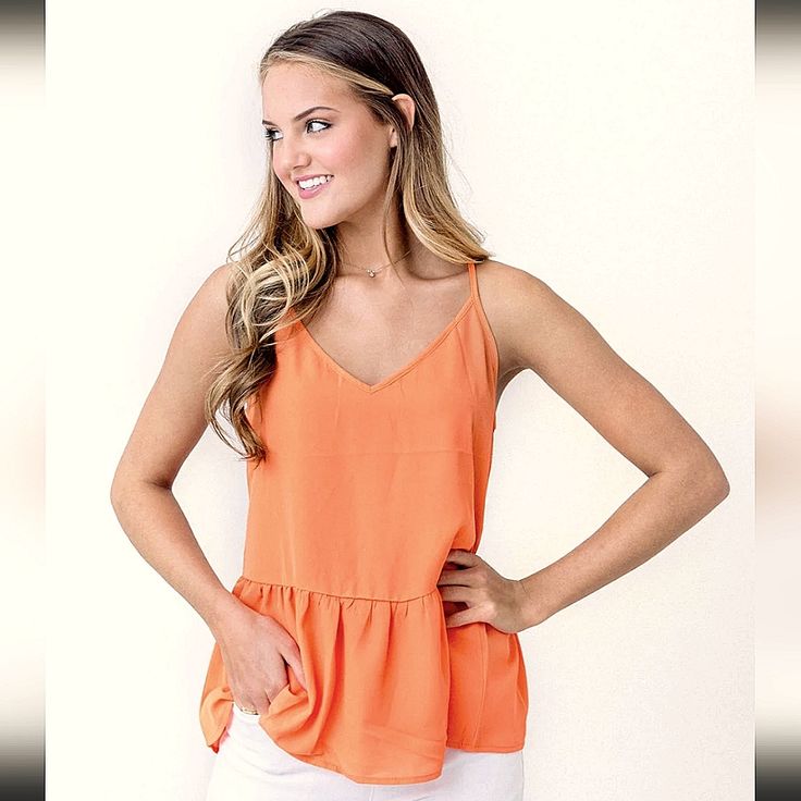 Nordstrom Soprano Sleeveless Peplum Top Size L. Has A V-Neck, Adjustable Straps And Stretchy Elastic Band On The Back. Very Cute And Lightweight! Brand New!! New With Tags No Rips Or Stains Smoke And Pet Free Home Color May Slightly Differ Due To Lighting Tag Says The Color Is Orange But It Has A Hint Of A Pink Undertone And It Looks More Like A Coral. Cover Photo For Look Reference Only, Similar Style But Not Actual Top For Sale. 100% Rayon Spring Orange V-neck Tank Top, Orange V-neck Tank Top For Spring, Sleeveless Summer Peplum Top, Sleeveless Summer Peplum Top For Day Out, Chic V-neck Peplum Top For Summer, Sleeveless Casual Peplum Top For Summer, Casual Sleeveless Peplum Top For Summer, Orange V-neck Tank Top For Summer, Orange Camisole Tank Top For Spring