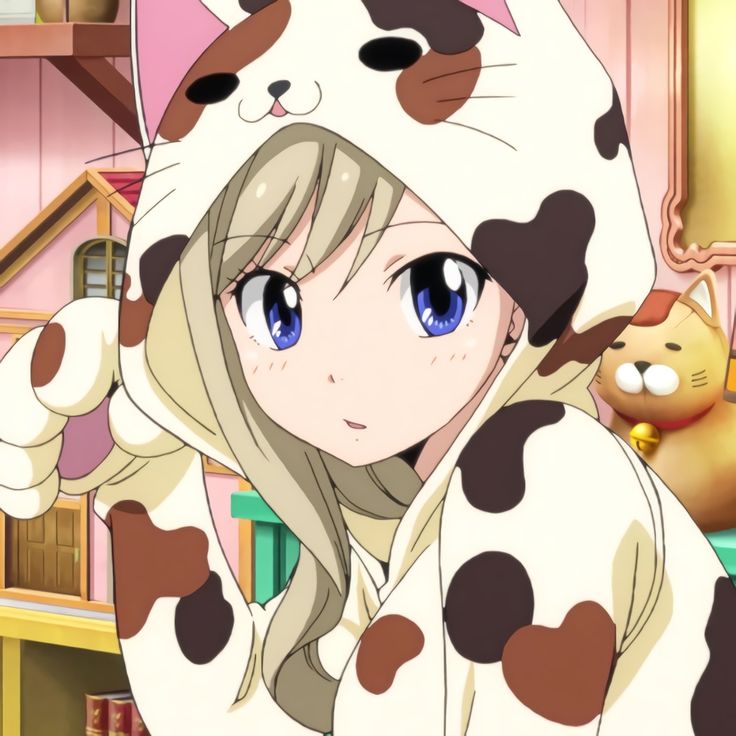 a girl in a dalmatian outfit standing next to a cat