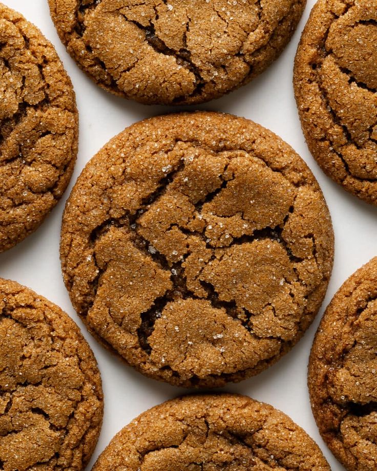 several cookies are arranged on a white surface