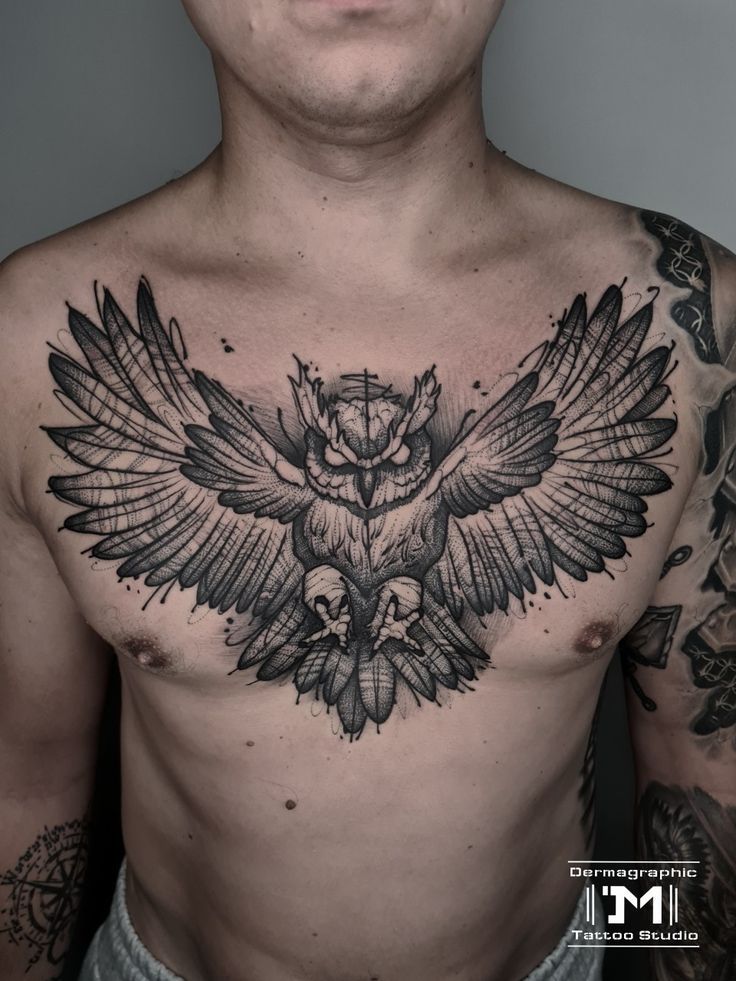 a man with an owl tattoo on his chest