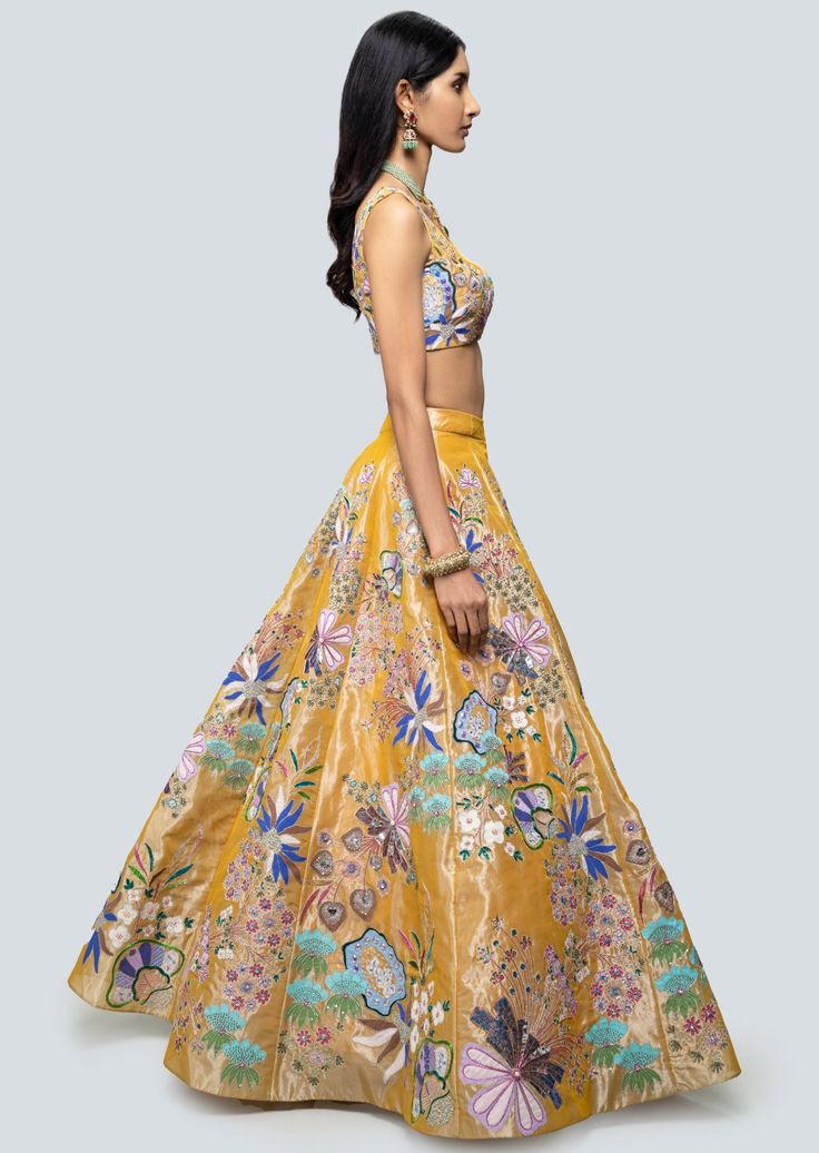 Multicolored amber applique and embellished kali tissue lehenga with sleeveless blouse and floral border net dupatta. Silk Anarkali Set With Floral Embroidery In Yellow, Silk Yellow Sharara With Floral Embroidery, Yellow Silk Sharara With Floral Embroidery, Bollywood Style Sleeveless Organza Dress, Tissue Silk Sets With Floral Embroidery For Reception, Silk Lehenga With Pallu, Sleeveless Silk Choli With Intricate Embroidery, Navratri Organza Lehenga With Floral Embroidery, Floral Embroidered Organza Lehenga For Navratri