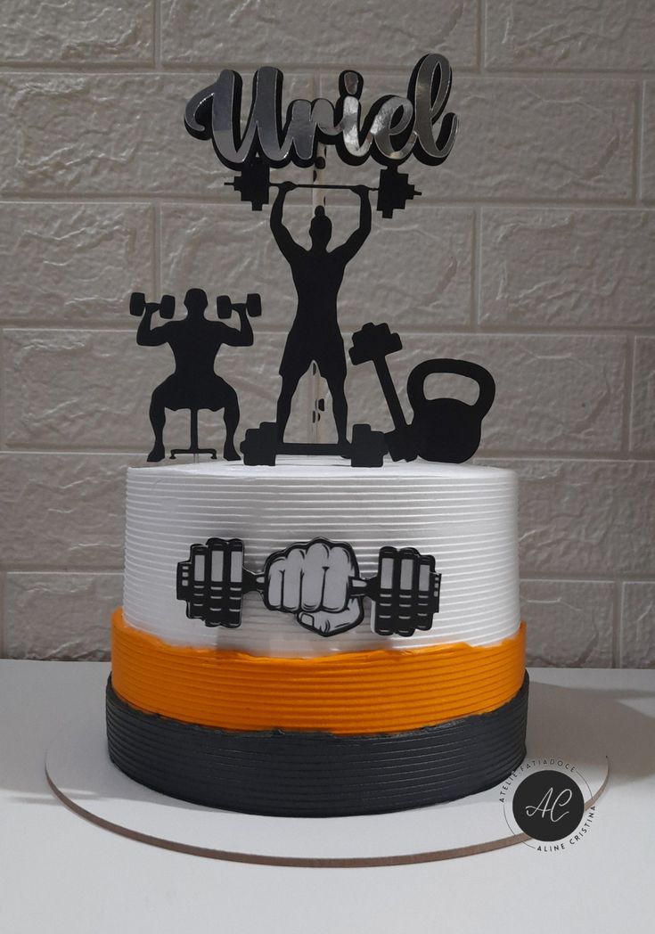 a cake that has a man holding a barbell on it with the word'wire'in front of him