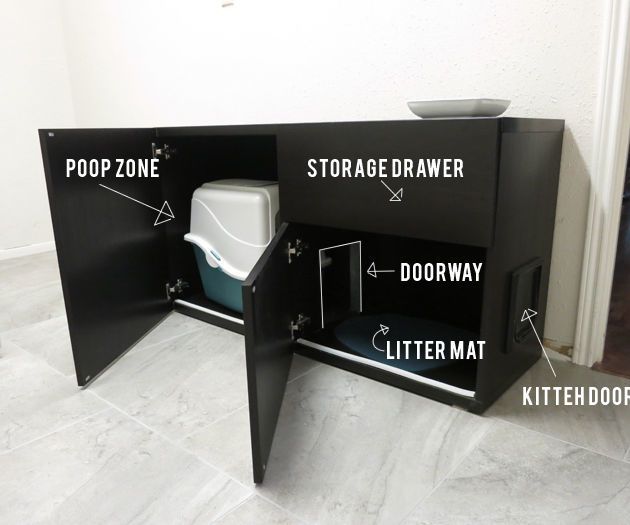 an open toilet sitting on top of a white floor next to a wooden cabinet with the words storage drawer written above it