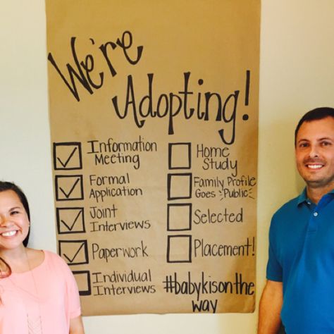 two people standing in front of a sign that says we're appetizing