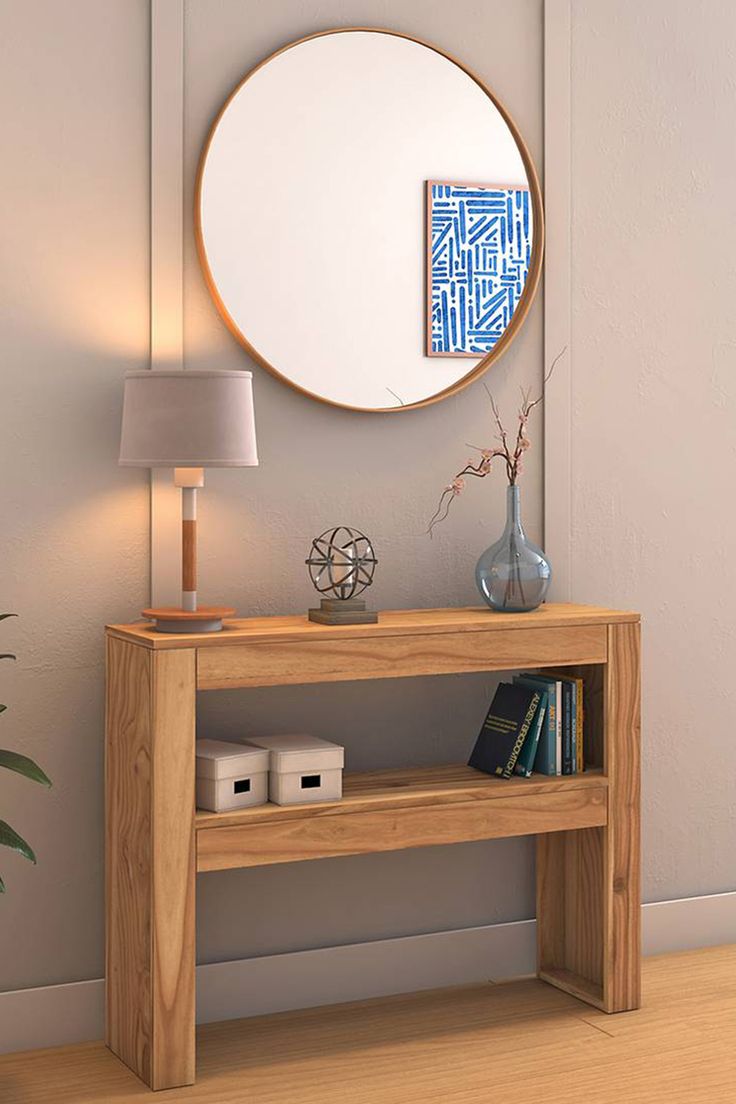 a mirror on the wall above a wooden table