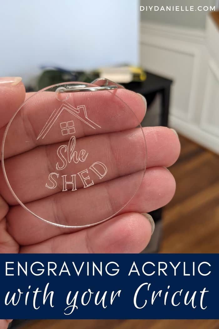 a hand holding an acrylic ornament with the words, engraving acrylic with your cricut