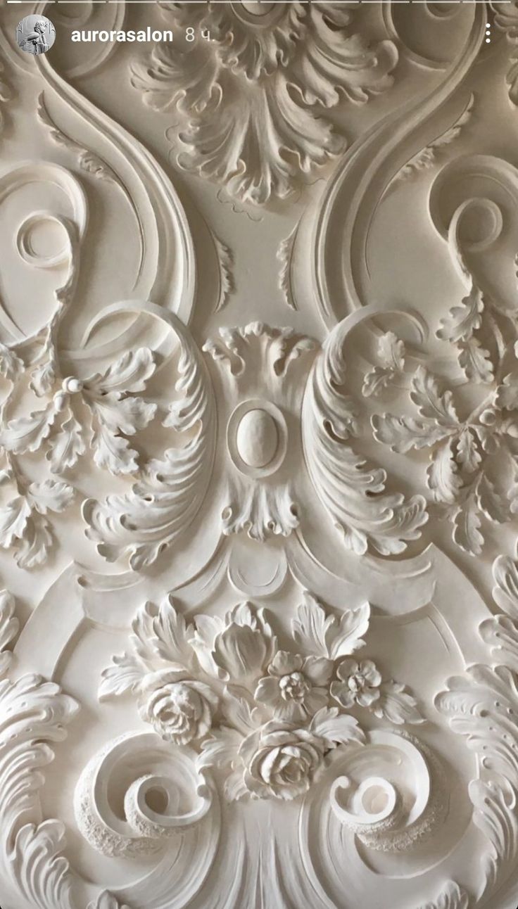 an intricately designed wall panel in white